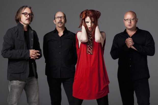 The Garbage band poses in stylish clothing against a simple background, HD Desktop Wallpaper