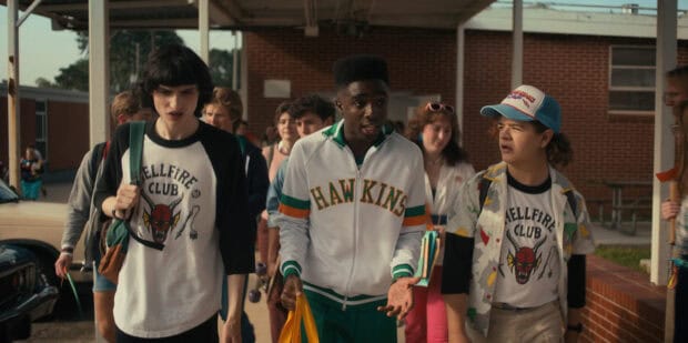 Gaten Matarazzo and his friends walk together at school in a lively scene, 2K Desktop Wallpaper