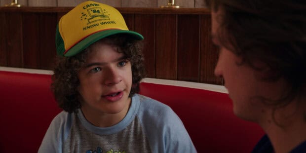 Gaten Matarazzo is talking to a person in a red booth setting, HD Desktop Wallpaper