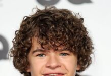 Gaten Matarazzo is smiling while wearing a black tuxedo and white bow tie, HD Phone Wallpaper