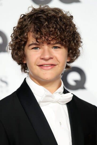 Gaten Matarazzo is smiling while wearing a black tuxedo and white bow tie, HD Phone Wallpaper