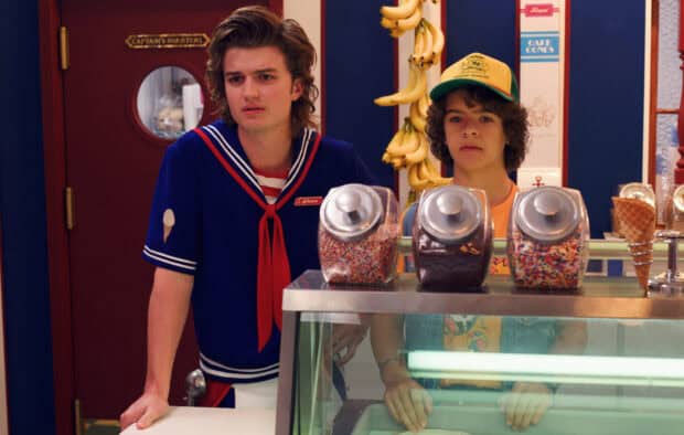 Gaten Matarazzo stands with a co star behind the counter at an ice cream shop, HD Desktop Wallpaper