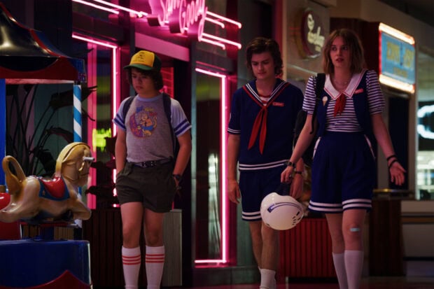Gaten Matarazzo and friends walk under neon lights, HD Desktop Wallpaper