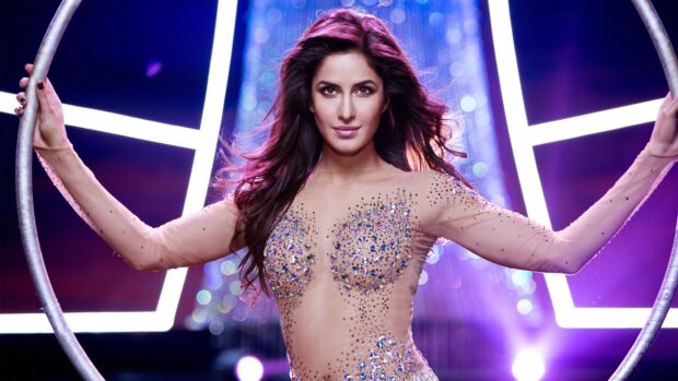 Katrina Kaif poses confidently in a dazzling outfit holding a circular frame, 4K Desktop Wallpaper