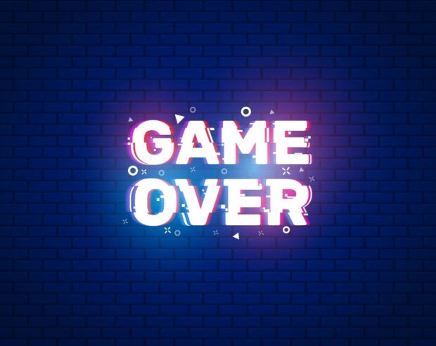 The image shows glitchy colorful game over text over a dark blue brick wall, HD Desktop Wallpaper