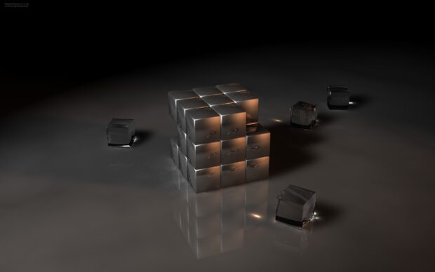 A shiny cube structure is surrounded by smaller transparent cubes on a reflective surface capturing cube wallpapers, 2K Desktop Wallpaper