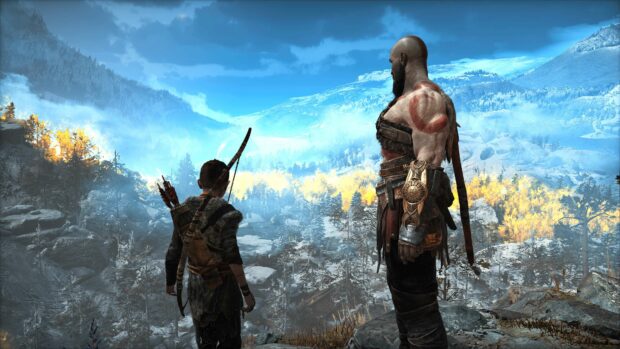 Kratos and Atreus stand on a mountain edge observing a snowy landscape, 4K PC Wallpaper