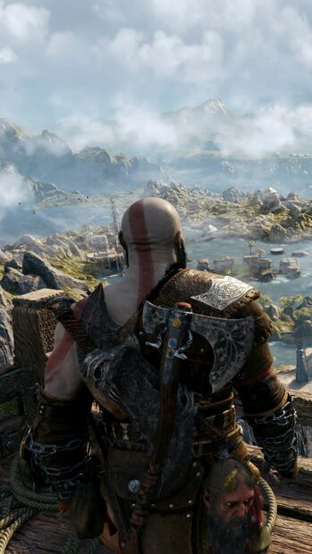 A warrior with a battle axe gazes across a vast mountainous terrain in the game God Of War Wallpapers, 4K Phone Wallpaper