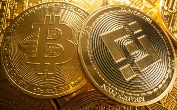 Golden Bitcoin and Binance coins represent cryptocurrency in digital finance, HD Desktop Wallpaper