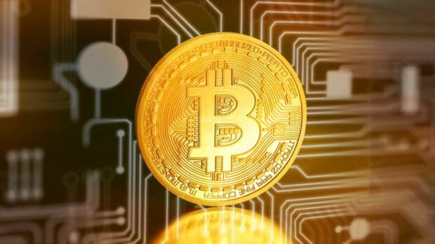 A golden Bitcoin coin is displayed with a digital circuit background, HD Desktop Wallpaper