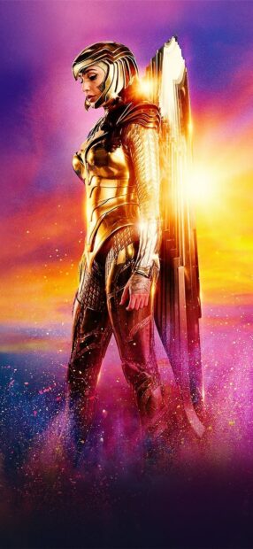 Wonder Woman stands proud in golden armor with wings against vibrant colors, HD Phone Wallpaper