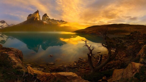 The golden sunrise illuminates the sharp peaks and calm lake at Torres Del Paine National Park, HD Desktop Wallpaper