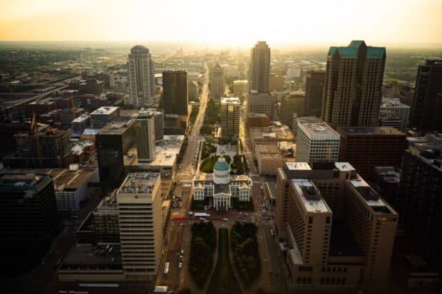 The St Louis skyline shows historic and modern buildings during sunset, HD Desktop Wallpaper