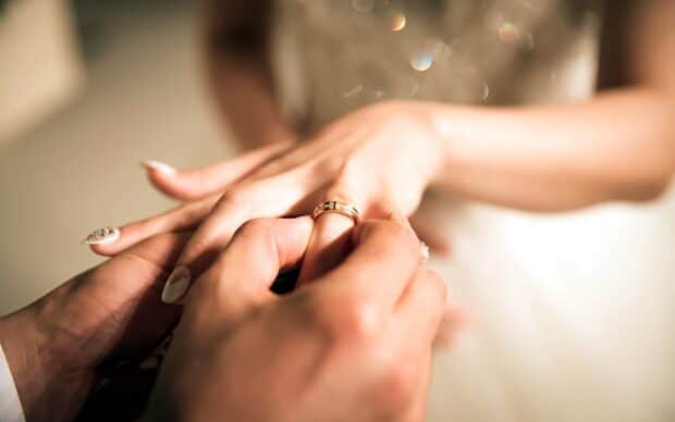 A close up of a hand receiving a golden wedding ring in a wedding ceremony, HD Desktop Wallpaper