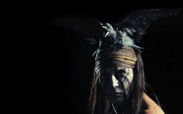 A close up of Gore Verbinski with cracked face paint and a crow perched on his head, 2K Desktop Wallpaper