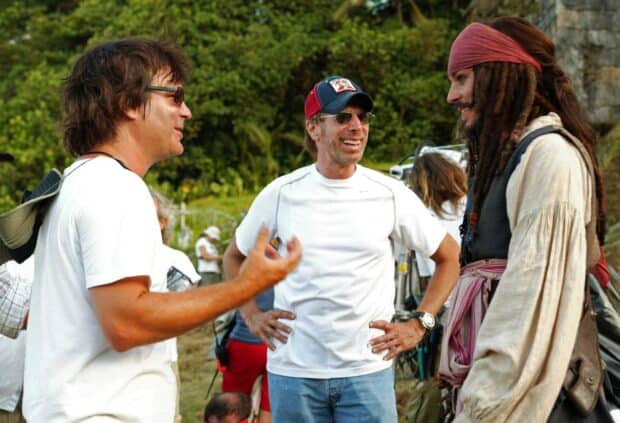 Gore Verbinski is having a conversation on set with actors outdoors, HD Desktop Wallpaper