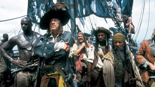 A pirate crew stands on a ship deck with sails behind in Gore Verbinski, HD Desktop Wallpaper