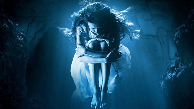 A woman is curled up underwater in a dark blue environment representing Gore Verbinski, 4K Desktop Wallpaper