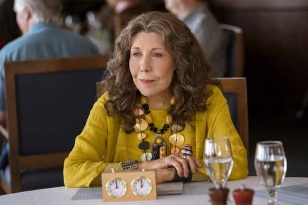 Grace And Frankie Netflix wallpapers featuring a woman in a yellow outfit sitting at a table, HD Desktop Wallpaper