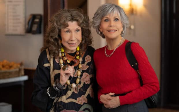 Grace And Frankie characters smiling together in a cozy indoor setting from the series, HD Desktop Wallpaper