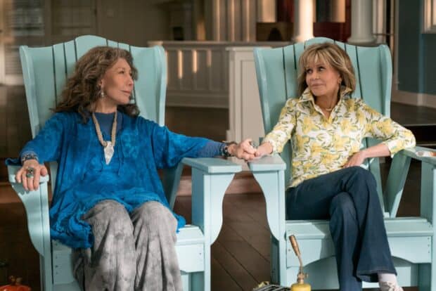 Grace And Frankie Netflix Wallpapers show two women sitting and holding hands on pastel blue chairs, HD Desktop Wallpaper