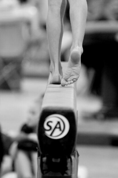 A close up of feet walking on a balance beam during a gymnastics routine, HD Desktop Wallpaper