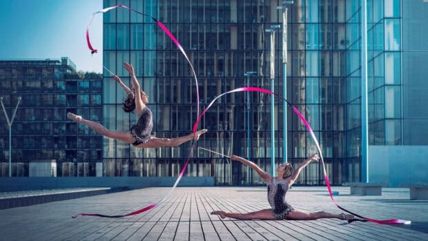 Two athletes performing rhythmic gymnastics with ribbons outside, HD Desktop Wallpaper