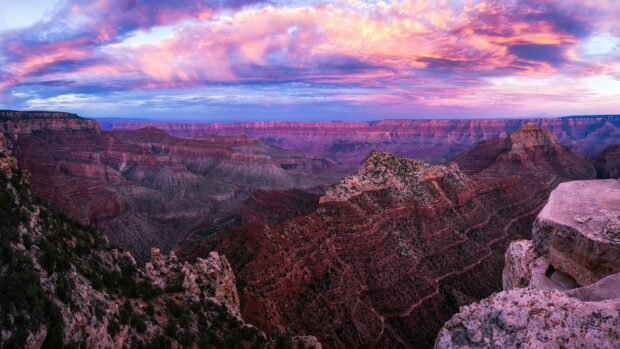The Grand Canyon displays stunning cliffs and vibrant sky at sunset, 4K Desktop Wallpaper