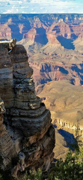 The Grand Canyon features vast rock formations under a clear sky, HD Phone Wallpaper