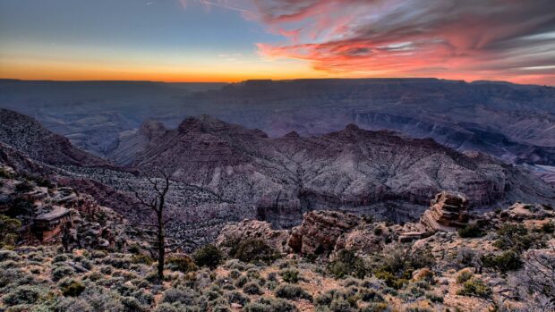 A breathtaking view of the Grand Canyon at sunset with colorful skies, 4K Desktop Wallpaper