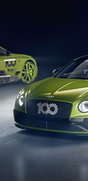 A green Bentley Continental GT with racing decals is shown in a dimly lit setting, 2K Phone Wallpaper