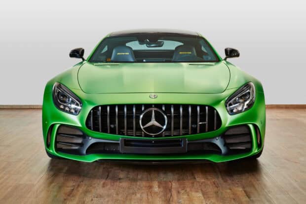 A Mercedes Benz AMG GT is shown parked indoors on a wooden floor, HD Desktop Wallpaper