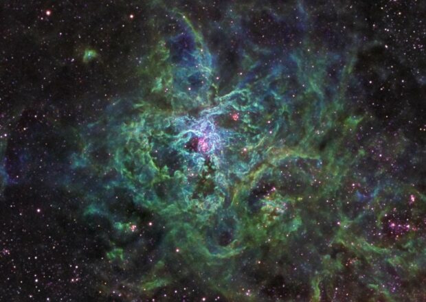 The green nebula lights glow vividly in the vast space filled with stars, HD Desktop Wallpaper