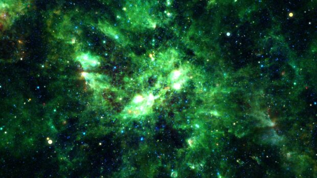 A vibrant green nebula spreads across deep space filled with stars and cosmic dust, 4K Desktop Wallpaper