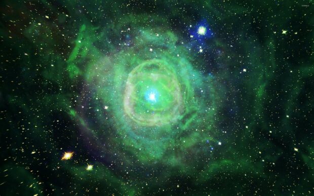 A bright green nebula glowing in deep space with surrounding stars and cosmic dust, 2K Desktop Wallpaper