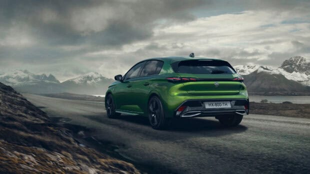 A green Peugeot 308 is driving on a road with mountains and cloudy sky in the background, 4K Desktop Wallpaper