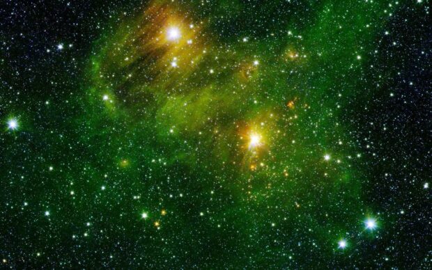 A green nebula glows brightly among numerous stars in the vast universe, HD Desktop Wallpaper