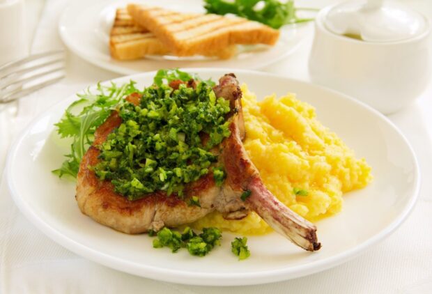 A grilled pork chop topped with green herbs served with mashed potatoes and toast, HD Desktop Wallpaper
