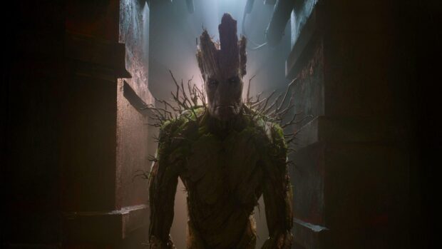 Groot stands tall with branches and moss on his body, HD Desktop Wallpaper