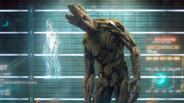 Groot stands in front of a futuristic screen with glowing holograms and data, HD Desktop Wallpaper