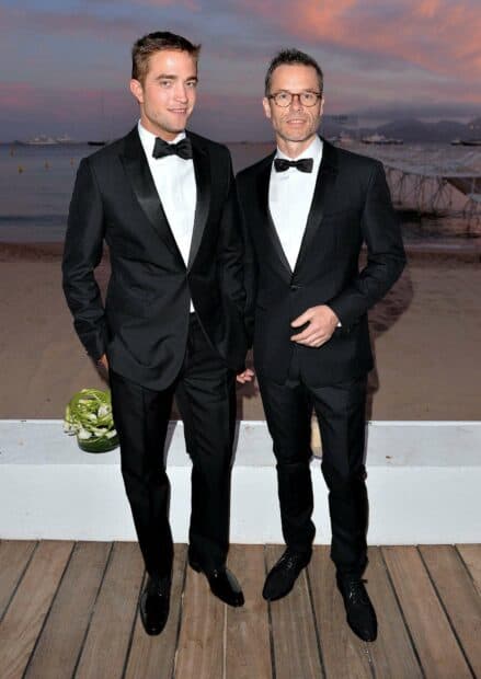 Guy Pearce and another man wearing tuxedos stand outdoors near the beach at sunset, HD Desktop Wallpaper