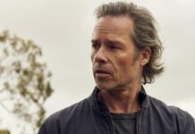 Guy Pearce wallpapers showing a man with unkempt hair wearing a dark jacket outdoors, HD Desktop Wallpaper