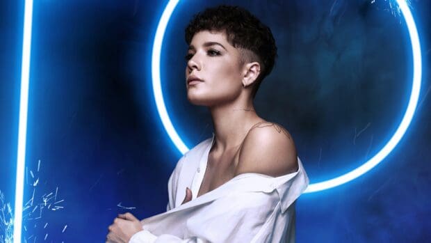 A portrait of Halsey looking thoughtful with blue neon lights behind her, 4K PC Wallpaper