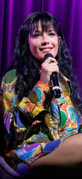 Halsey wallpapers showing a close up of a female singer holding a microphone with a colorful outfit, HD Phone Wallpaper