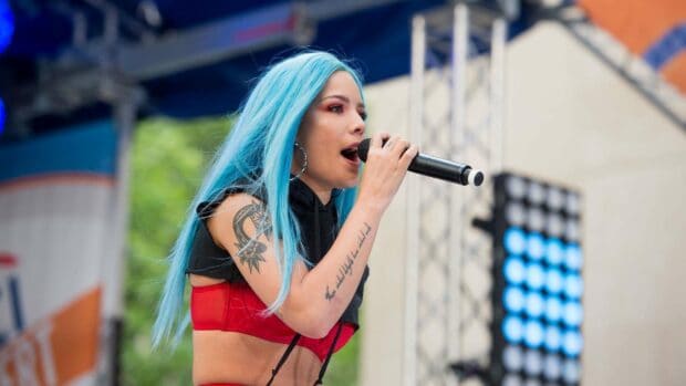 Halsey with blue hair is performing live on stage holding a microphone, HD Desktop Wallpaper