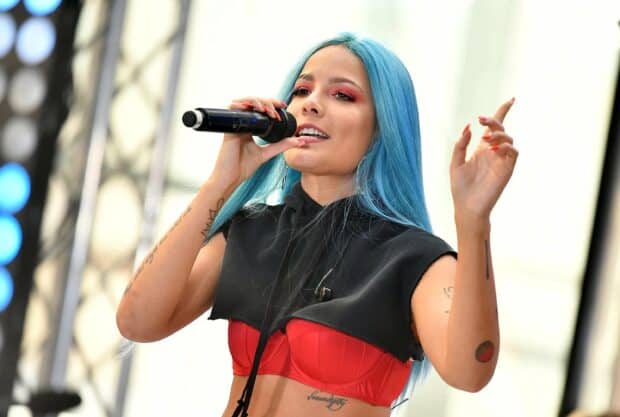 Halsey with blue hair performing live on stage holding a microphone, 2K Desktop Wallpaper