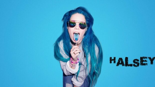 A portrait of Halsey with blue hair licking a blue lollipop against a blue background, HD Desktop Wallpaper