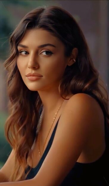 A close up portrait of Hande Ercel showing her calm expression and wavy hair, HD Phone Wallpaper