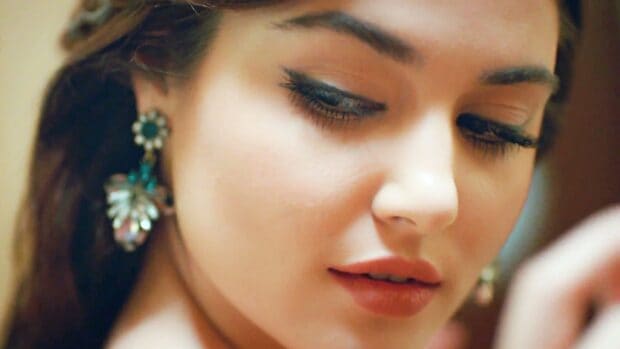 A close up portrait of Hande Ercel showing her elegant makeup and earrings, HD Mobile Wallpaper