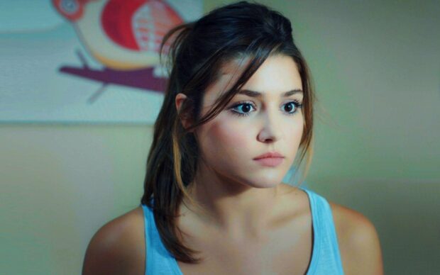 A close up of Hande Ercel with natural makeup and tied back hair looking thoughtful, HD Phone Wallpaper